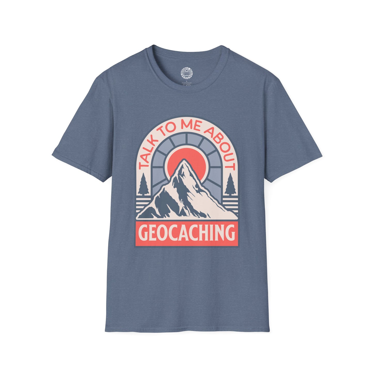 Blue t-shirt with a mountain graphic and text 'Talk to me about geocaching' on a white background