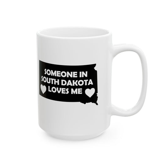 White mug with black graphic and text 'Someone in South Dakota loves me' on a white background