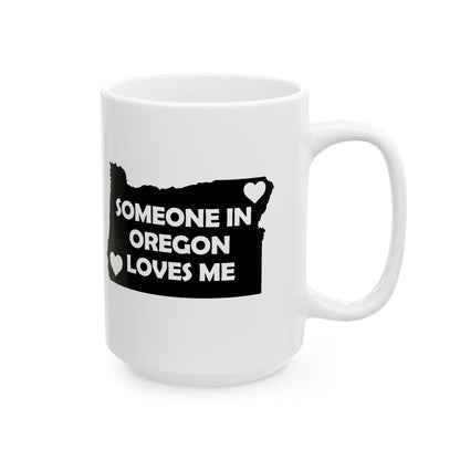 White mug with black design featuring 'Someone in Oregon Loves Me' text on a white background