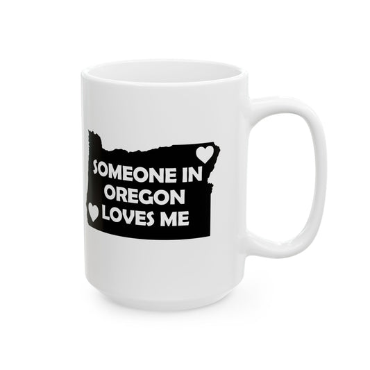 White mug with black design featuring 'Someone in Oregon Loves Me' text on a white background