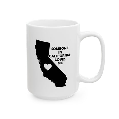 White mug with black silhouette of California and text 'SOMEONE IN CALIFORNIA LOVES ME' on a white background