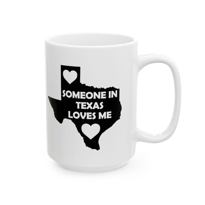White mug with black Texas outline and text 'SOMEONE IN TEXAS LOVES ME' on a white background