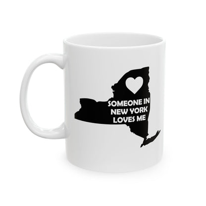 White mug with black silhouette of New York state and text 'Someone in New York Loves Me' on a white background