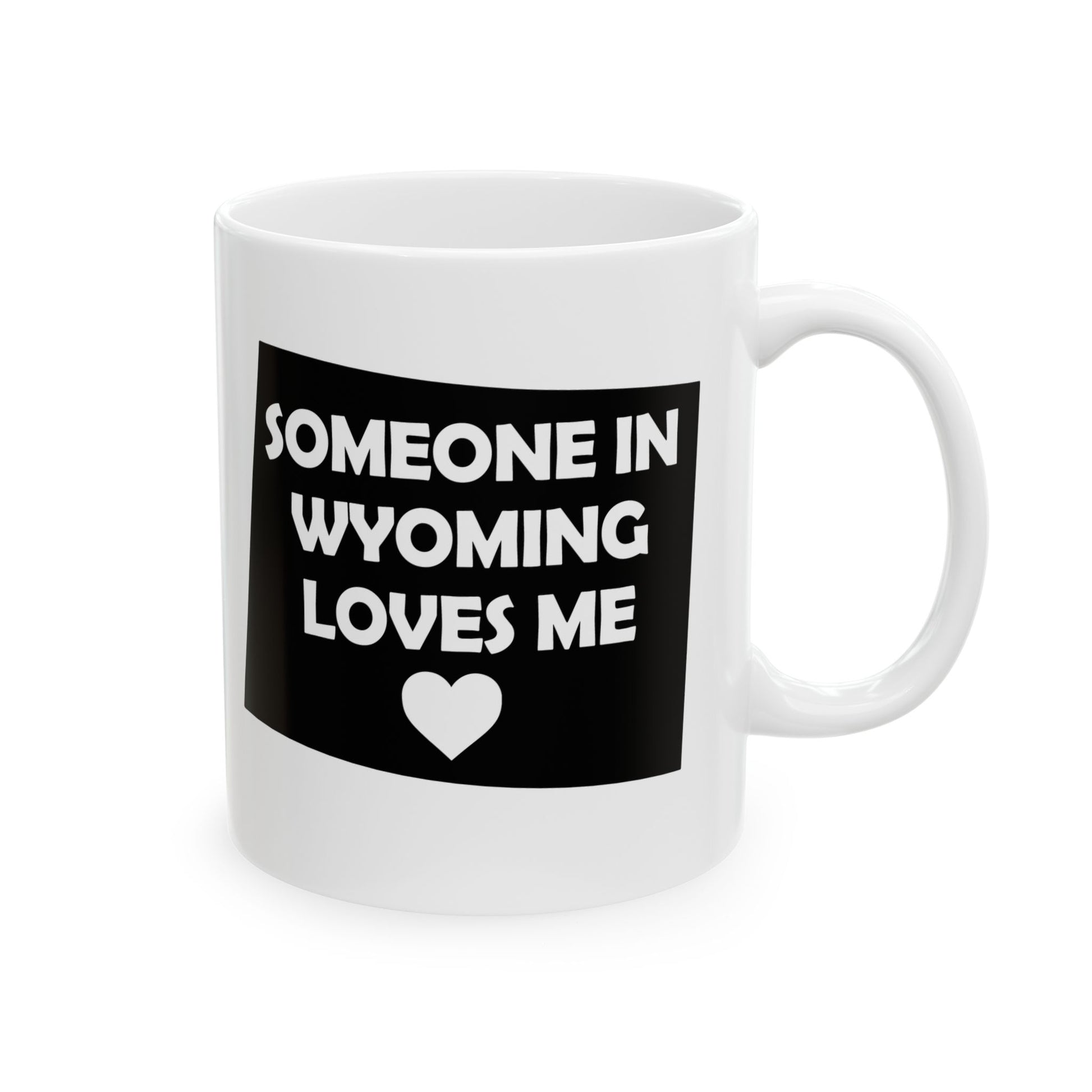 White mug with a black label that says 'Someone in Wyoming loves me' on a white background