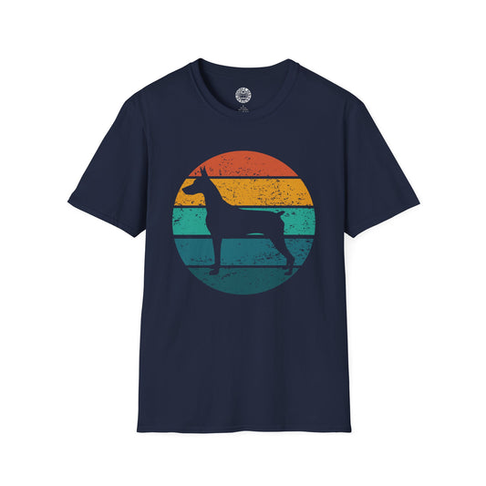 Navy blue t-shirt with a colorful graphic of a doberman pinscher dog silhouette against a sunset background on a white background.
