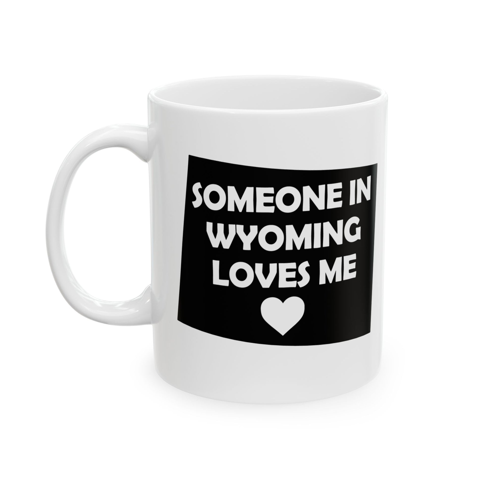 White mug with black graphic and text 'Someone in Wyoming loves me' on a white background