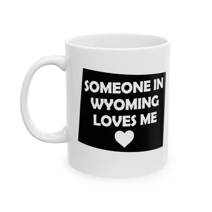 White mug with black graphic and text 'Someone in Wyoming loves me' on a white background