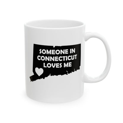 White mug with black design of Connecticut and text 'Someone in Connecticut loves me' on a white background