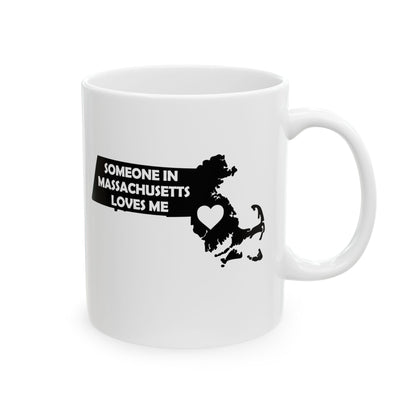 White mug with black text and map of Massachusetts on a white background with text  Someone In Massachusetts Loves Me