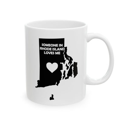 White mug with black silhouette of Rhode Island and text 'Someone in Rhode Island loves me' on a white background