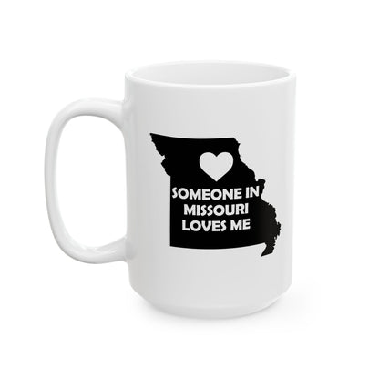 White mug with black text and heart design on a white background with text  Someone In Missouri Loves Me