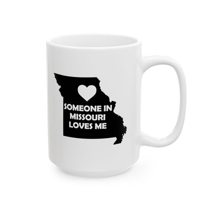 White mug with black silhouette of Missouri and text 'Someone in Missouri loves me' on a white background