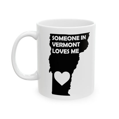 White mug with black design of Vermont map and heart, text 'Someone in Vermont loves me' on a white background