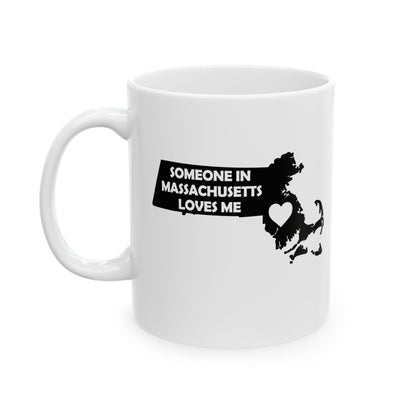White mug with black text and map of Massachusetts on a white background with text  Someone In Massachusetts Loves Me