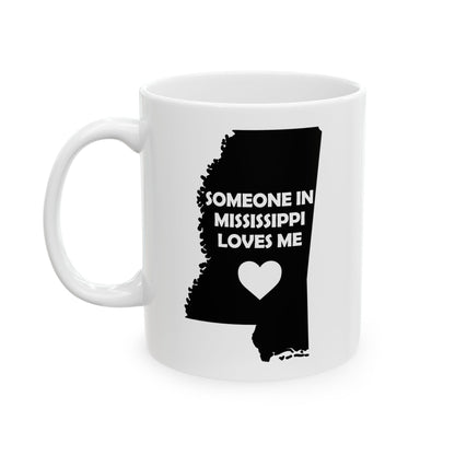 White mug with black outline of Mississippi and text 'Someone in Mississippi loves me' on a white background