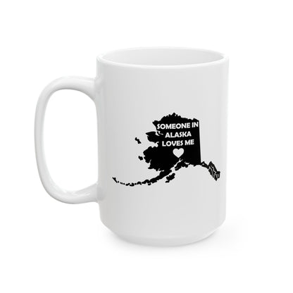 White mug with black map of Alaska and text 'Someone in Alaska loves me' on a white background