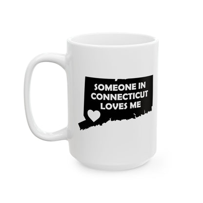 White mug with black text Someone In Connecticut Loves Me and heart design on a white background