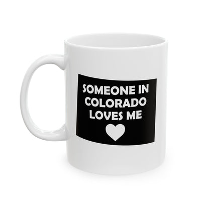 White mug with black graphic and text 'Someone in Colorado loves me' on a white background