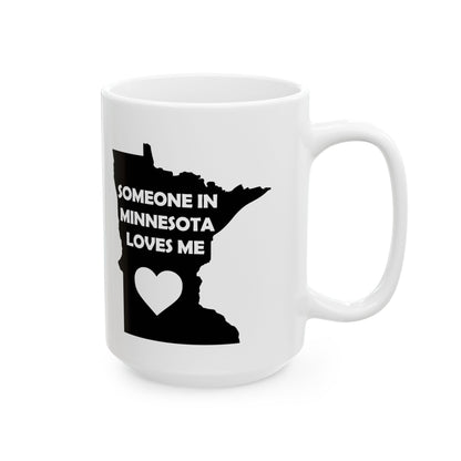 White mug with black silhouette of Minnesota and text 'Someone in Minnesota loves me' on a white background
