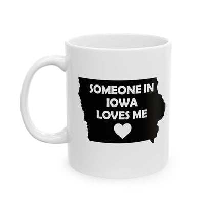 White mug with black Iowa outline and text 'Someone in Iowa loves me' on a white background