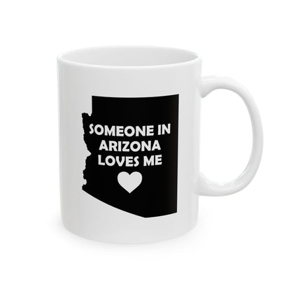 White mug with black silhouette of Arizona and text 'Someone in Arizona loves me' on a white background