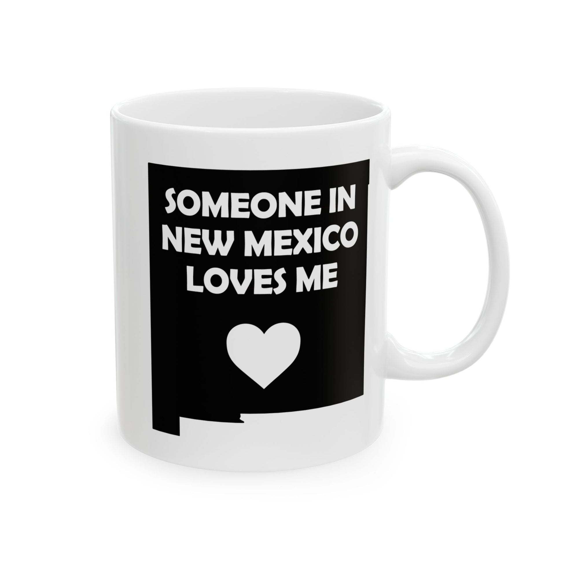White mug with black design featuring text and a heart on a white background with text  Someone In New Mexico Loves Me