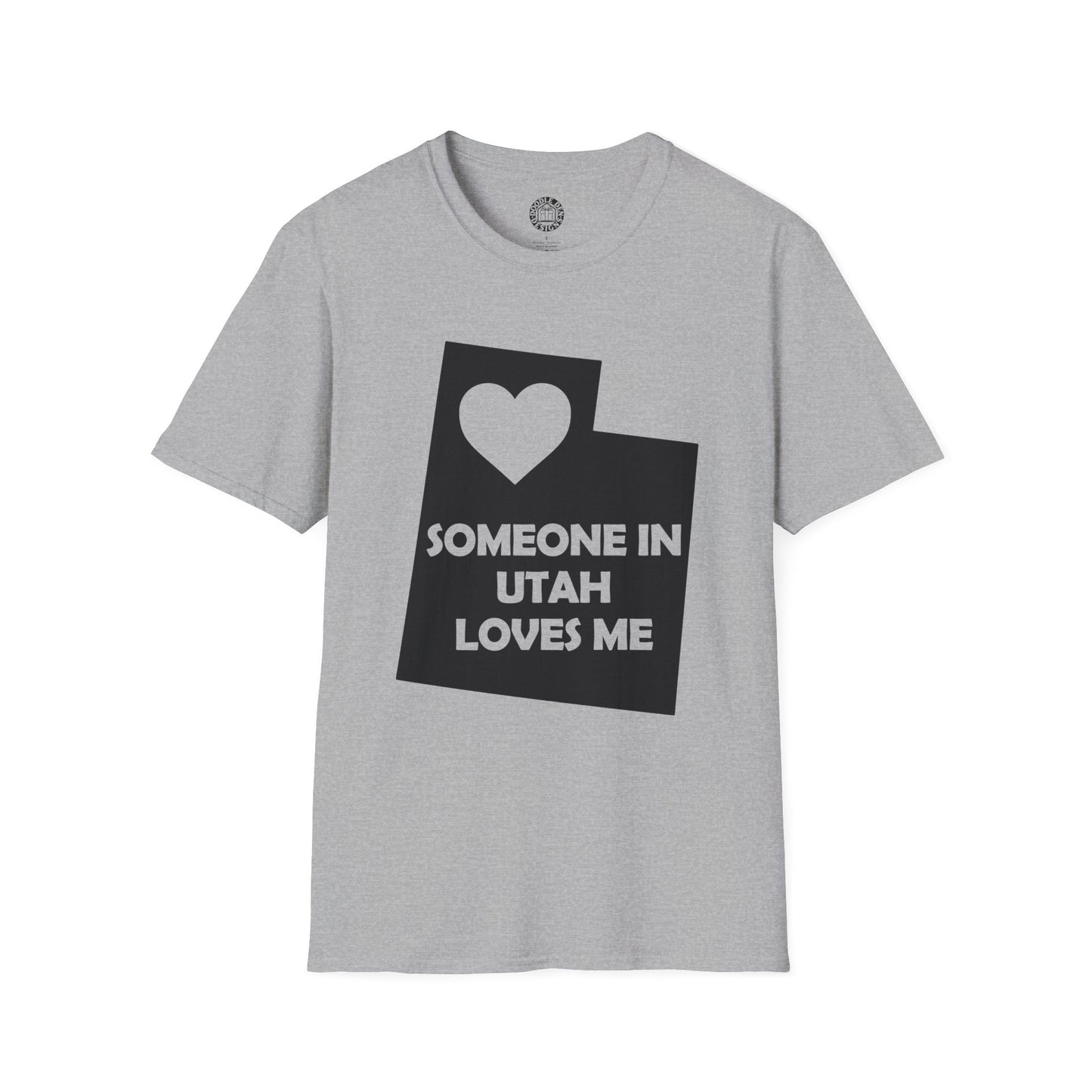 Gray t-shirt with a black graphic and text on a white background   with text  Someone In Utah Loves Me