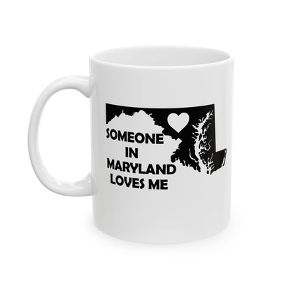 White mug with black text and outline of Maryland on a white background with text  Someone In Maryland Loves Me