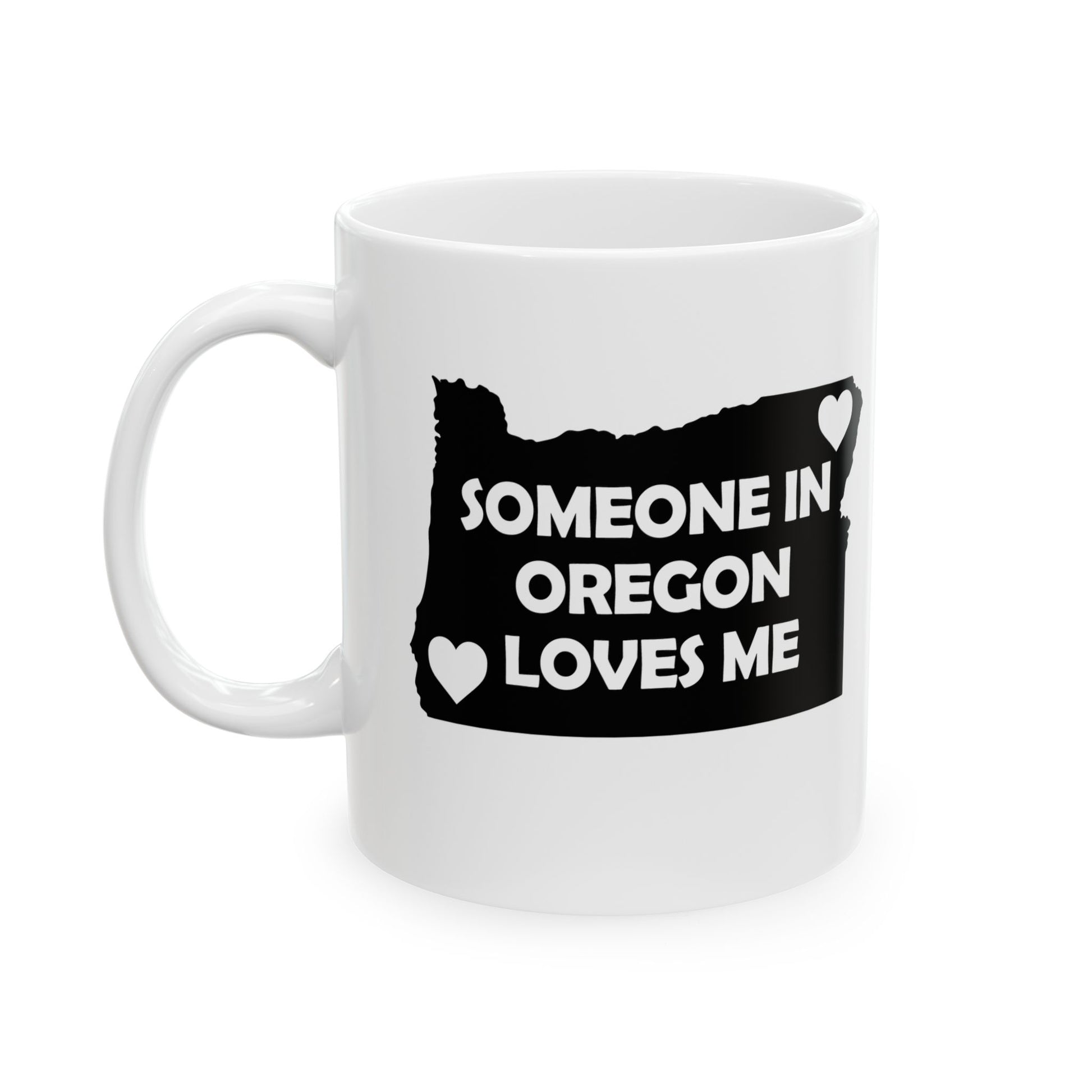 White mug with black design of Oregon map and text 'Someone in Oregon loves me' on a white background