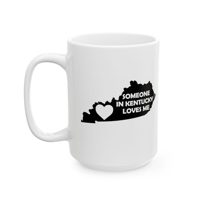 White mug with black text and heart design on a white background with text  Someone In Kentucky Loves Me