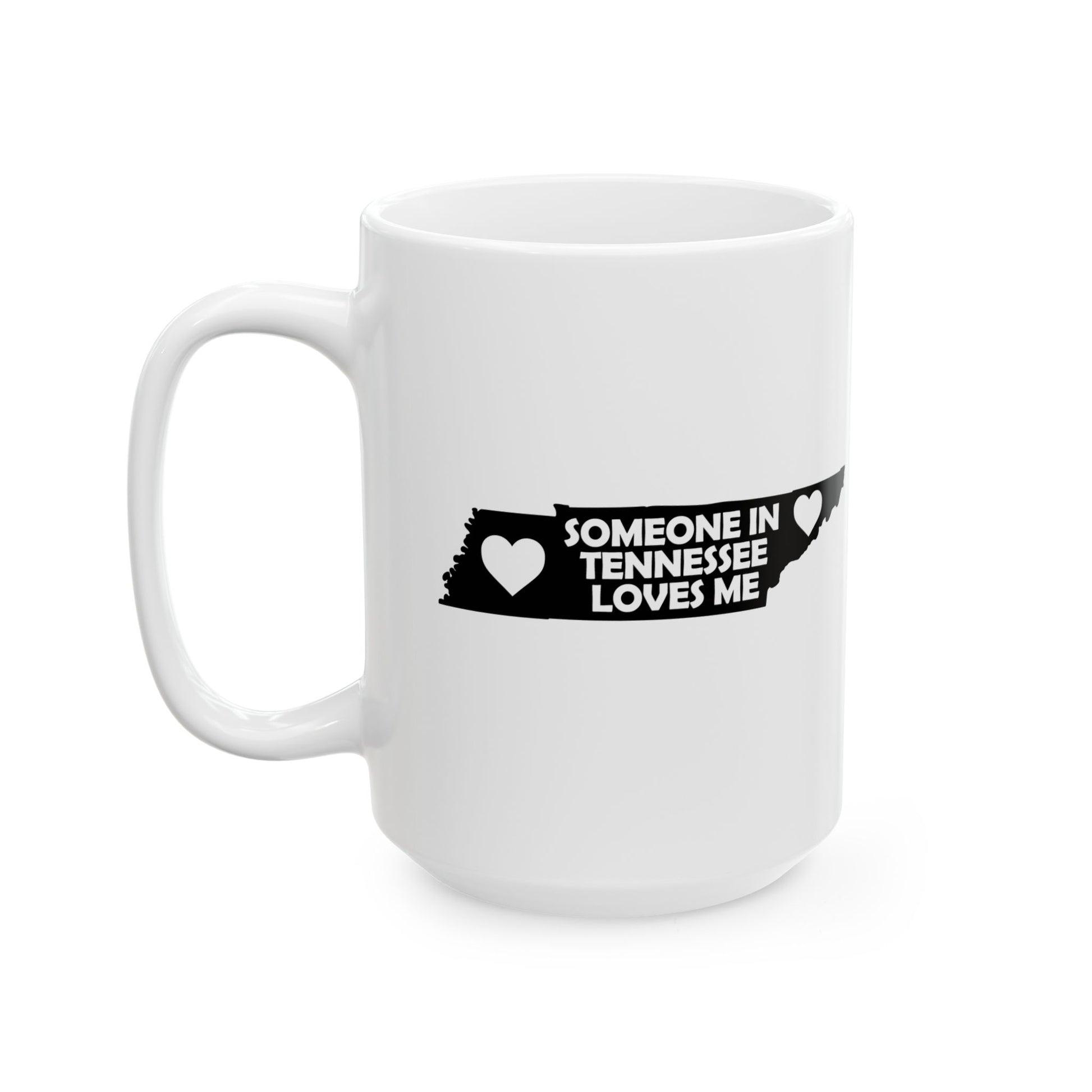 White mug with black text and heart design on a white background  with text  Someone In Tennessee Loves Me