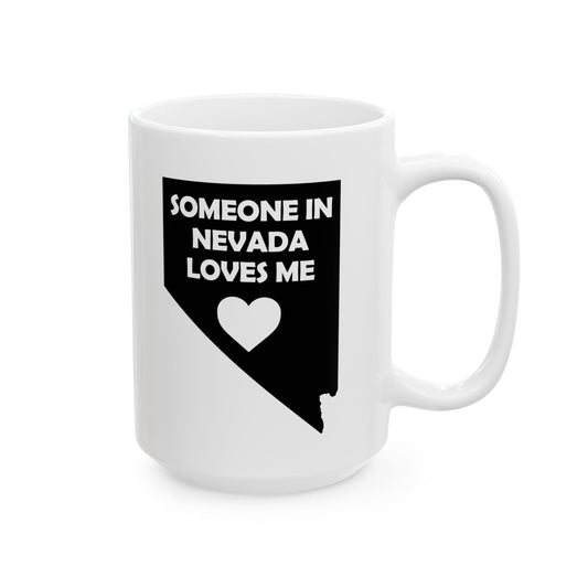 White mug with black text and heart design on a white background with text  Someone In Nevada Loves Me