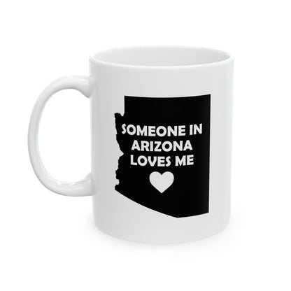 White mug with black Arizona outline and text 'Someone in Arizona loves me' on a white background