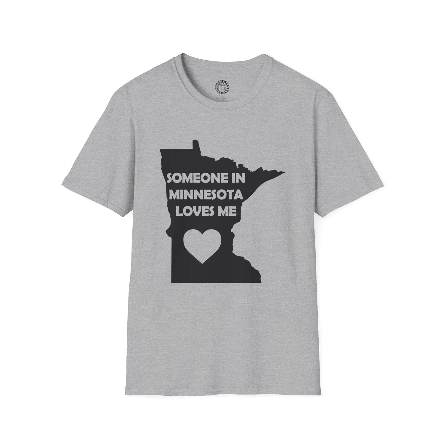 Gray t-shirt with black graphic and text 'SOMEONE IN MINNESOTA LOVES ME' on a white background