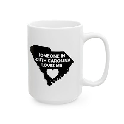 White mug with black text 'Someone in South Carolina loves me' and a heart on a white background