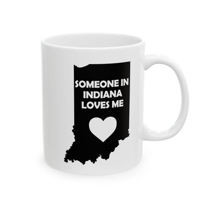 White mug with black Indiana outline and heart design on a white background with text Someone In Indiana Loves Me