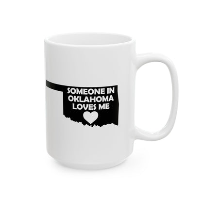 White mug with black text 'SOMEONE IN OKLAHOMA LOVES ME' on a white background