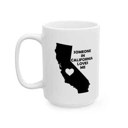 White mug with black silhouette of California and text 'Someone in California loves me' on a white background