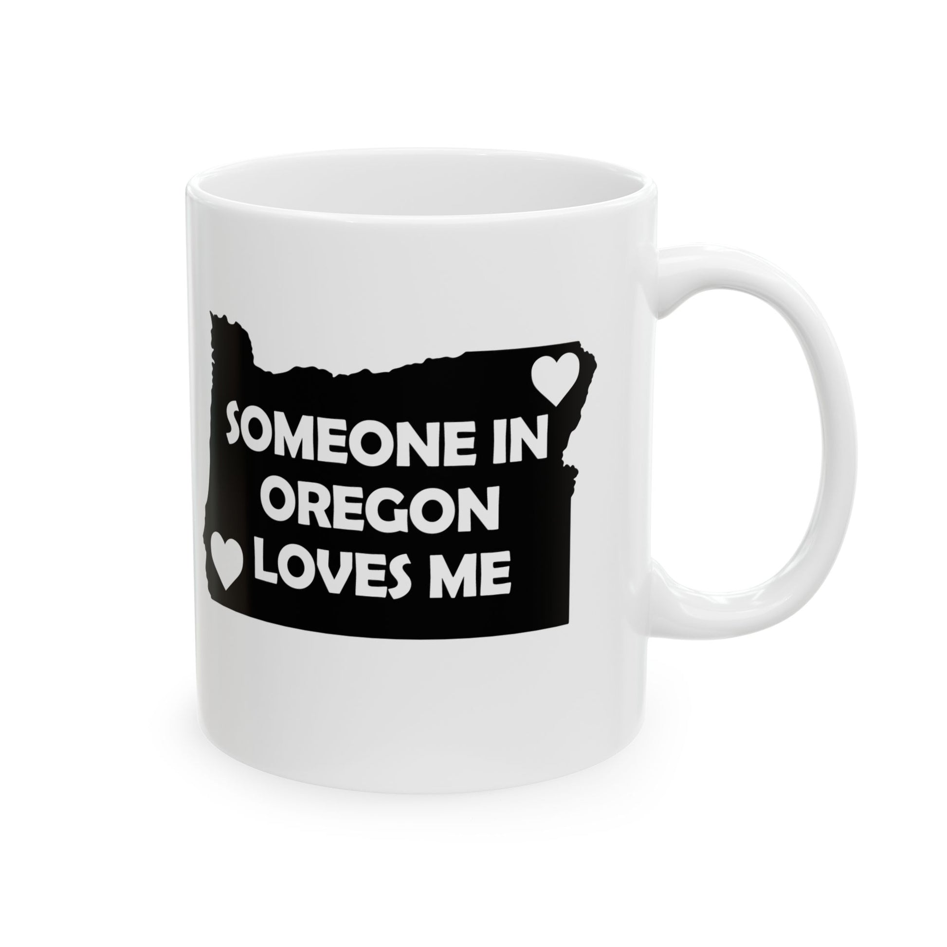 White mug with black design of Oregon map and text 'Someone in Oregon loves me' on a white background