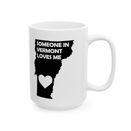 White mug with black silhouette of Vermont and text 'Someone in Vermont loves me' on a white background