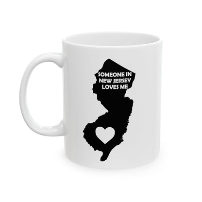 White mug with black silhouette of New Jersey and text 'Someone in New Jersey loves me' on a white background