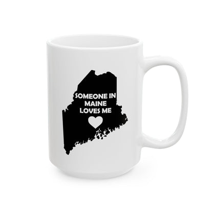 White mug with black silhouette of Maine and text 'Someone in Maine loves me' on a white background