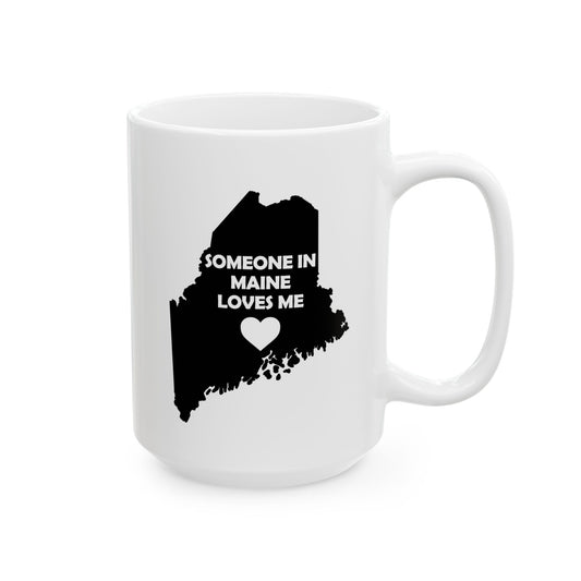 White mug with black silhouette of Maine and text 'Someone in Maine loves me' on a white background