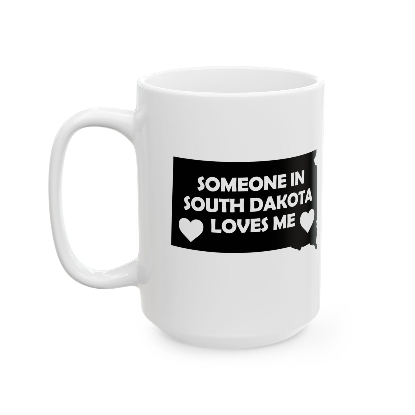 White mug with a black graphic and text 'Someone in South Dakota loves me' on a white background