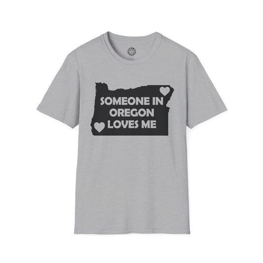 Gray t-shirt with a graphic design and text on a white background with text  Someone In Oregon Loves Me