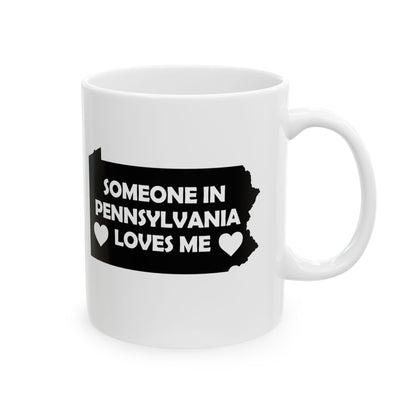 White mug with black design of Pennsylvania and text 'Someone in Pennsylvania loves me' on a white background