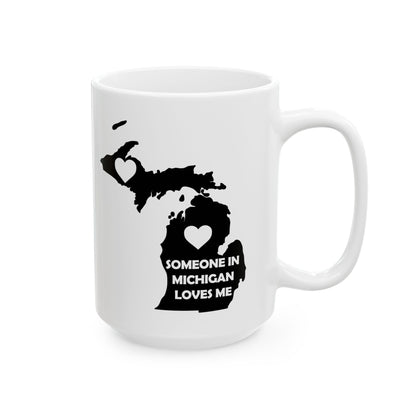 White mug with black map of Michigan and text 'Someone in Michigan loves me' on a white background