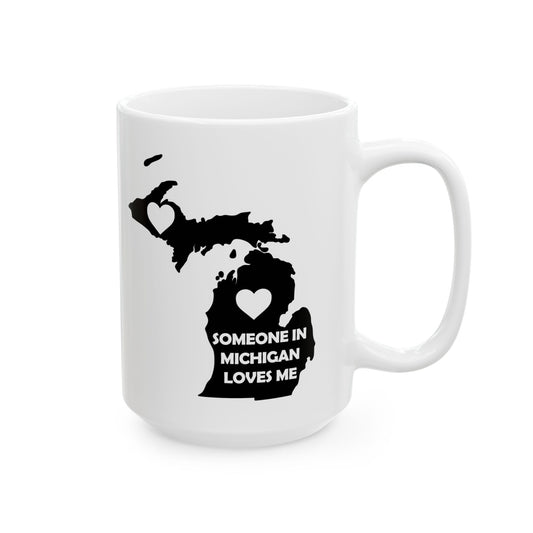White mug with black map of Michigan and text 'Someone in Michigan loves me' on a white background