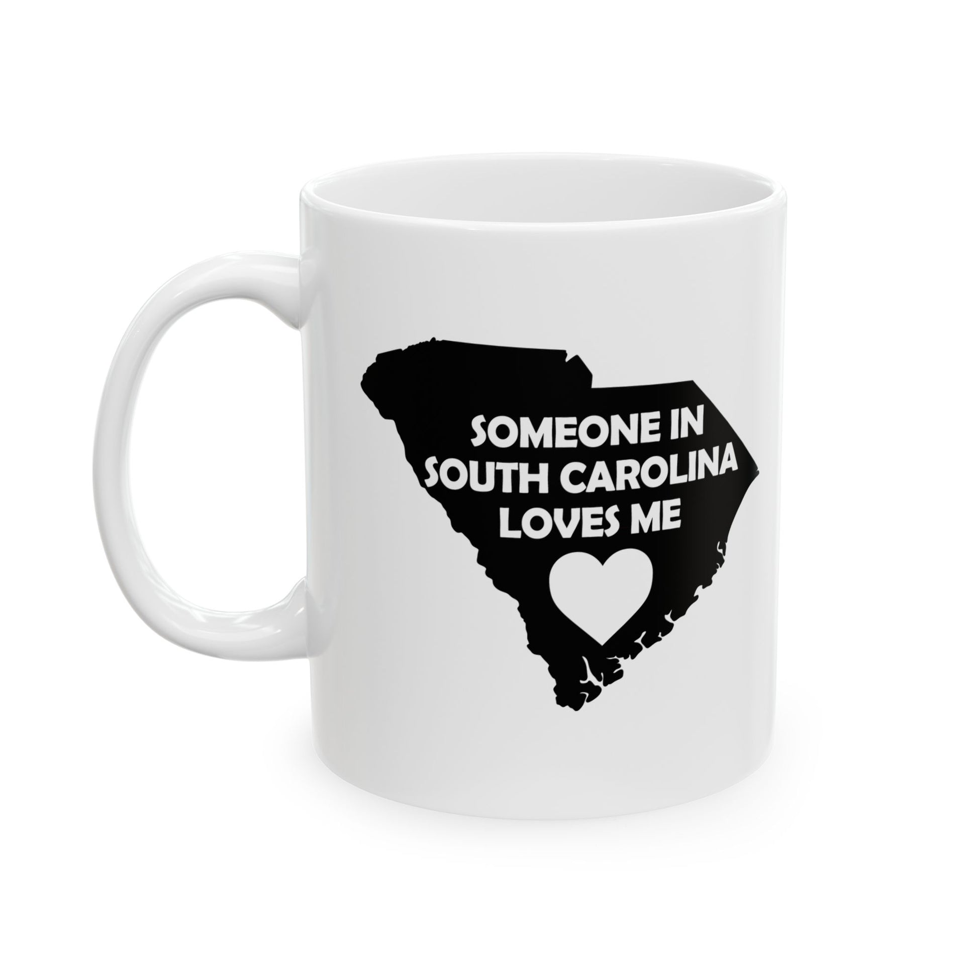 White mug with black silhouette of South Carolina and text 'Someone in South Carolina loves me' on a white background