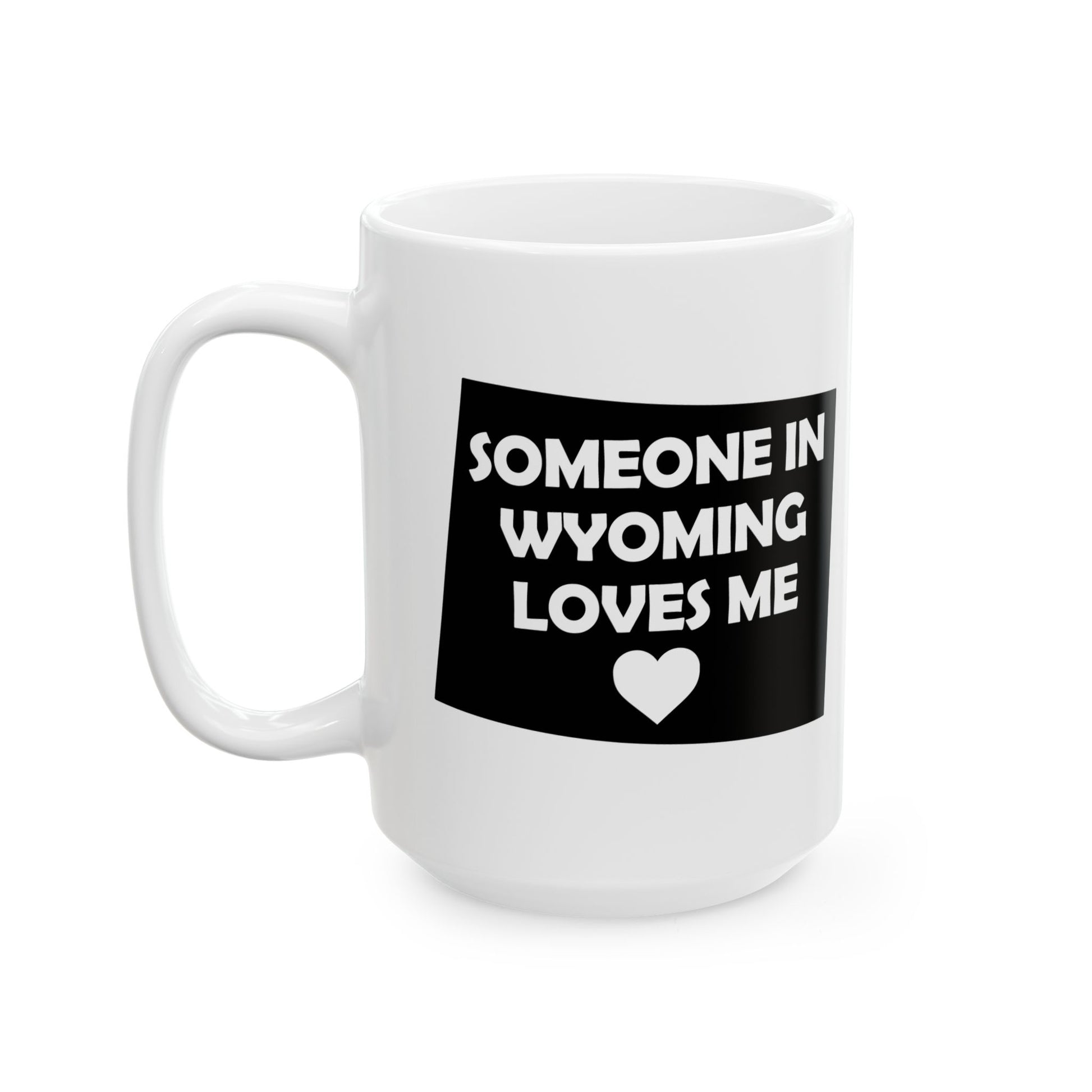 White mug with black text and heart design on a white background with text  Someone In Wyoming Loves Me